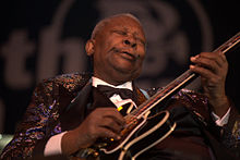 B. B. King performing with guitar